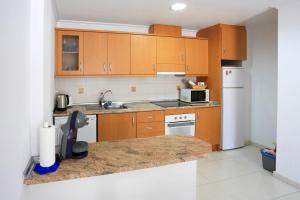Kuchyňa alebo kuchynka v ubytovaní Cabo Roig La Rotonda, Pool, Beach & Comfort