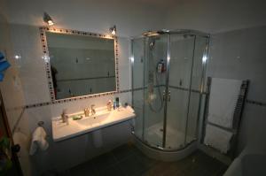 a bathroom with a shower and a sink at Casa Caracol in Praia do Carvoeiro +11 photos