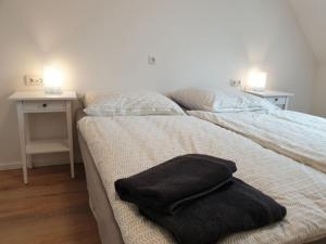 Postel nebo postele na pokoji v ubytování Ferienwohnung Vogels Mühle