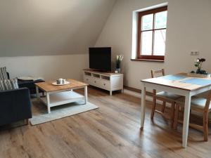 TV a/nebo společenská místnost v ubytování Ferienwohnung Vogels Mühle
