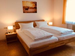 Postel nebo postele na pokoji v ubytování Ferienwohnung Heimatliebe