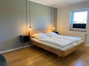 Postel nebo postele na pokoji v ubytování Ferienhaus Sundowner FH6