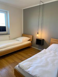 Postel nebo postele na pokoji v ubytování Ferienhaus Sundowner FH6
