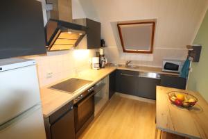 Kuchyň nebo kuchyňský kout v ubytování Ferienwohnung am Barockgarten