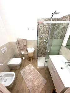 a bathroom with a shower and a toilet and a sink at MH Montessori Home in Minerbio +42 photos