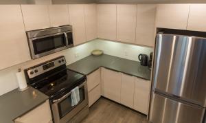 Kuchyň nebo kuchyňský kout v ubytování Uptown Oasis + 18 fotografií