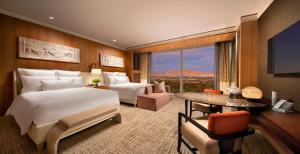 Postel nebo postele na pokoji v ubytování Encore at Wynn Las Vegas