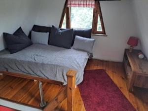 Ένα ή περισσότερα κρεβάτια σε δωμάτιο στο Finn Hütte Naturblick