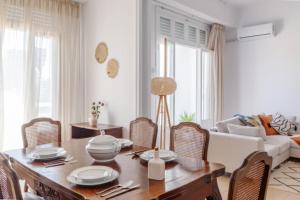 a living room with a table and chairs and a couch at Bohème in Tunis