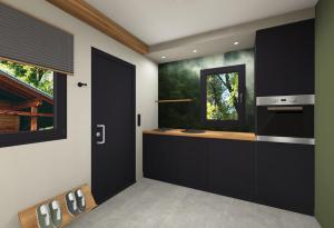 a kitchen with a black door and a window at Camper Lodge CL1 in Hindenberg