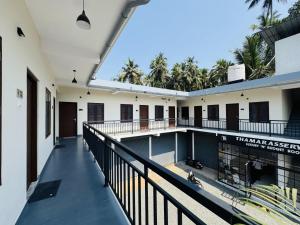 an external view of a building with a swimming pool at Thamarassery INN luxury and budget Rooms in Thamarassery