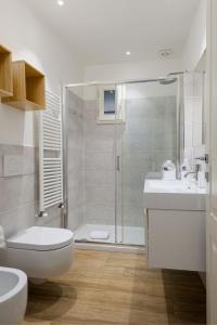 a bathroom with a toilet and a sink and a shower at UNYCA - Peaceful Retreat in the Heart of Florence in Florence