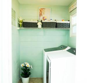 a laundry room with a washer and dryer at 100 Steps to beach access - 5 minute walk to the Village - Private Porch in Siesta Key +22 photos