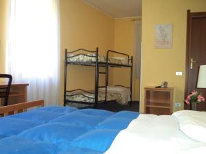 A bed or beds in a room at Hotel Il Nibbio