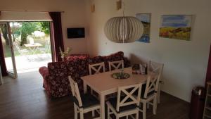 a living room with a table and a couch at Birkennest in Bingerbrück