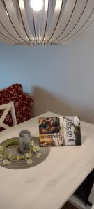 a table with a book and a cup of coffee at Birkennest in Bingerbrück
