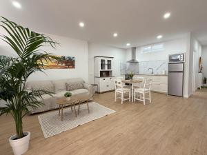 a living room with a couch and a table at Suites San Agustín 45 - Adults Only in Icod de los Vinos
