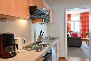 Η κουζίνα ή μικρή κουζίνα στο Ferienwohnung 10 Villa Celia Sellin