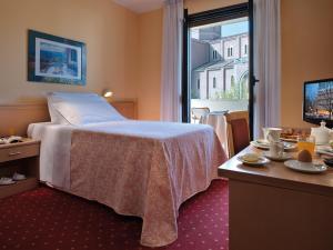 Postel nebo postele na pokoji v ubytování Hotel Terme Marco Polo