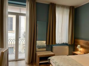 Postel nebo postele na pokoji v ubytování Delight Rooms