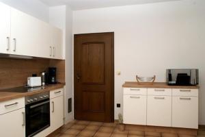 Kuchyň nebo kuchyňský kout v ubytování Haus "Zwischen den Wäldern" + 17 fotografií
