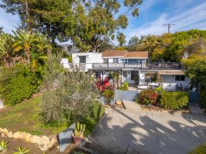 an aerial view of a white house with a deck at The Grand Escape - Casita Sonrisa in Summerland