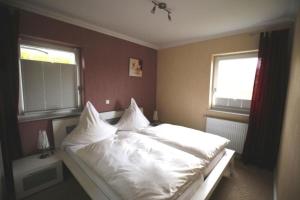 Postel nebo postele na pokoji v ubytování Ferienhaus Easy Holiday am Ritzhagen ehem Heinrichs