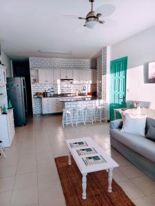 a living room and kitchen with a couch and a table at Miramar Atlántico Playa in Los Llanos de Aridane