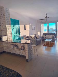 a living room with a couch and a table at Miramar Atlántico Playa in Los Llanos de Aridane +6 photos
