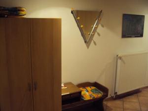 a room with a cabinet and a star on the wall at Appartement 2 Einzelzimmer Altes Land Jork bei HH in Jork +13 photos