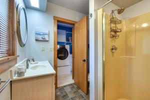 a bathroom with a sink and a washing machine at Enchanting Waterfront Sorrento Home with Deck! in Sorrento +19 photos