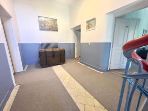 a room with a room with a suitcase on the floor at Gästehaus Sternschanze - App5 Leichtmatrose in Stralsund