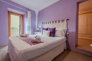 Postel nebo postele na pokoji v ubytování S'apposentu - Un'angolo di Paradiso con la Vista sul Castello