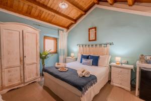 Postel nebo postele na pokoji v ubytování S'apposentu - Un'angolo di Paradiso con la Vista sul Castello