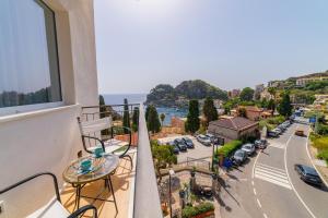 a balcony with a view of a street at Appartamento al Mare in Taormina
