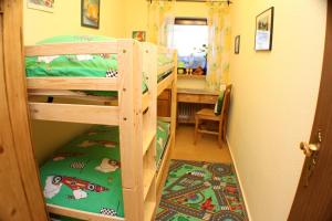 two bunk beds in a room with a hallway at Alpenspatzl in Reit im Winkl