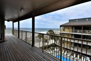A balcony or terrace at Sandpiper 7-C ON the BEACH- Smart TVs