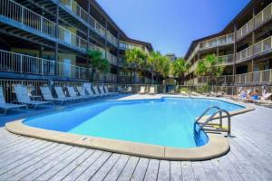 The swimming pool at or close to Sandpiper 7-C ON the BEACH- Smart TVs