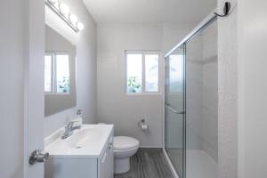 a white bathroom with a sink and a shower at Affordable Dorm Hayward in Hayward +38 photos