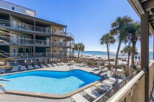 The swimming pool at or close to Sandpiper 7-C ON the BEACH- Smart TVs