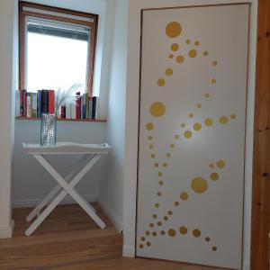 a door with dots on it in a room at "SüdWest" Ferienwohnung in Prerow