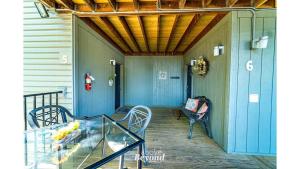 a person sitting on the porch of a house at Peaceful & No Stairs Minutes to Silver Dollar City in Reeds Spring