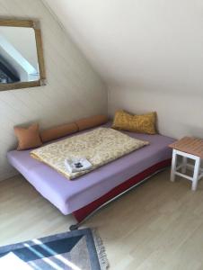 a bed in a small room with a mirror at Holiday in Wildflecken +7 photos