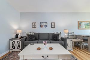 a living room with a couch and a table at Platte River Play Lovely 2bdr Barnhouse 2852 in Beulah