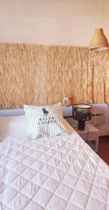 a bedroom with a bed and a wall with curtains at Apartment in Vilamoura with pool in Quarteira