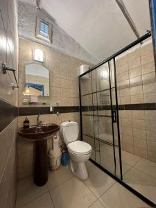 a bathroom with a toilet and a sink at ZBB Villa & Bungalow in Alanya