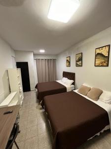 Кровать или кровати в номере Hotel Herrera