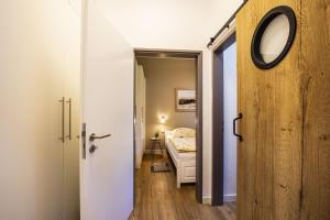 Ένα ή περισσότερα κρεβάτια σε δωμάτιο στο Treibholz im Wikingerhof