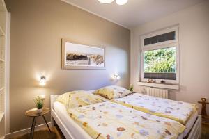 Ένα ή περισσότερα κρεβάτια σε δωμάτιο στο Treibholz im Wikingerhof