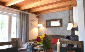 a living room with a couch and a table at Kormoran Muschelsucher in Prerow